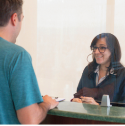 Stem cell clinic administrator talking to a patient