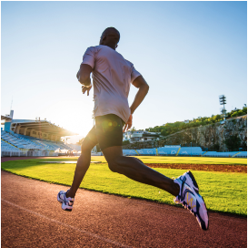 man running on an outdoor track after receiving stem cells for sports injuries